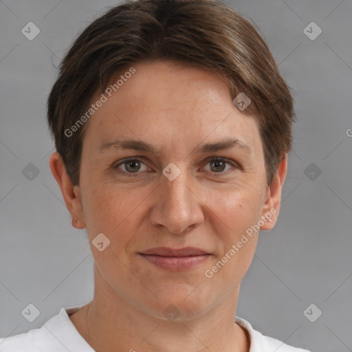 Joyful white adult female with short  brown hair and brown eyes