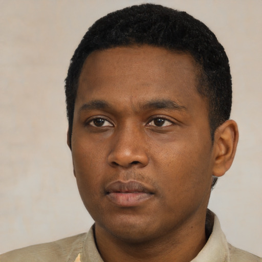 Neutral black young-adult male with short  black hair and brown eyes