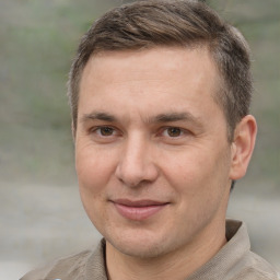 Joyful white adult male with short  brown hair and brown eyes