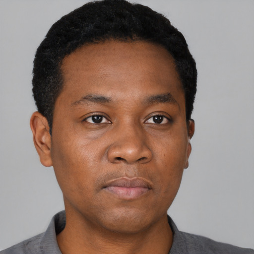 Neutral black young-adult male with short  black hair and brown eyes