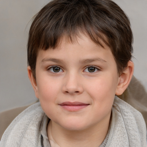 Joyful white child female with short  brown hair and brown eyes