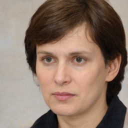 Neutral white adult female with medium  brown hair and brown eyes