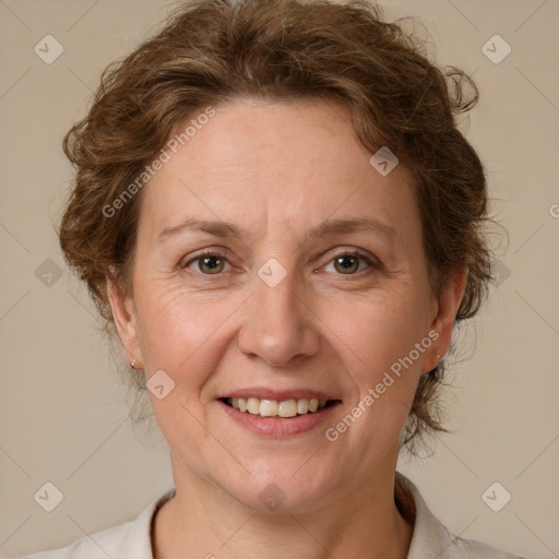 Joyful white adult female with short  brown hair and brown eyes