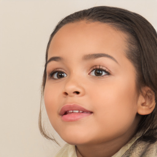 Joyful white child female with medium  brown hair and brown eyes