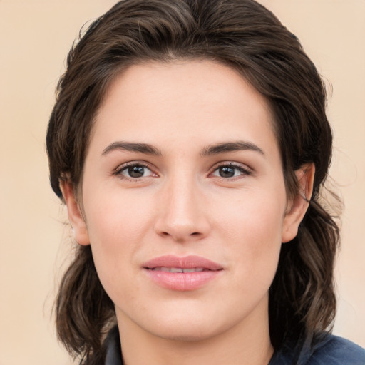 Joyful white young-adult female with medium  brown hair and brown eyes