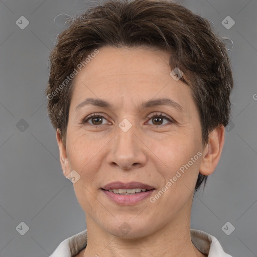 Joyful white adult female with short  brown hair and brown eyes