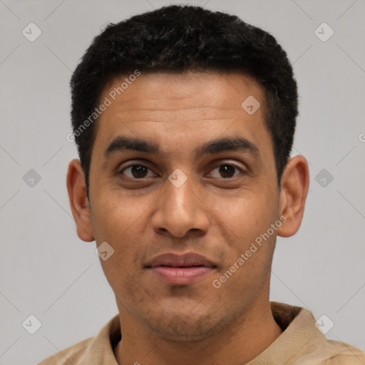 Joyful latino young-adult male with short  black hair and brown eyes