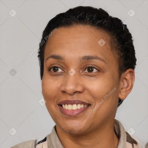 Joyful latino adult female with short  brown hair and brown eyes