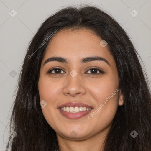 Joyful latino young-adult female with long  brown hair and brown eyes