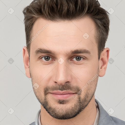 Joyful white young-adult male with short  brown hair and brown eyes