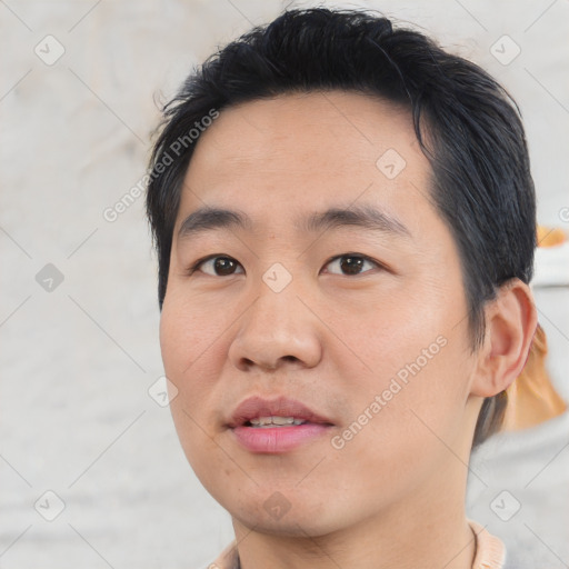 Joyful asian young-adult male with short  black hair and brown eyes