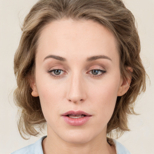 Neutral white young-adult female with medium  brown hair and green eyes