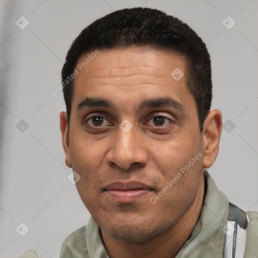 Joyful white adult male with short  black hair and brown eyes