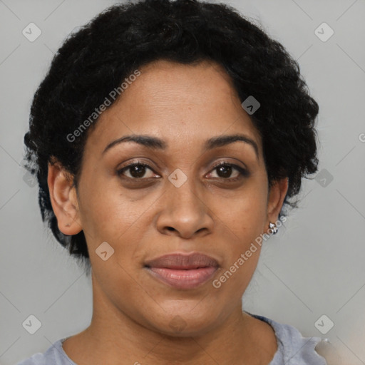 Joyful black adult female with short  brown hair and brown eyes