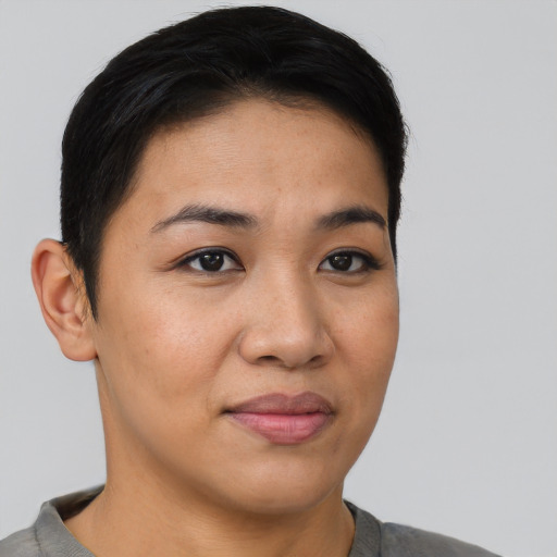 Joyful asian young-adult female with short  brown hair and brown eyes