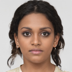 Neutral black young-adult female with medium  brown hair and brown eyes