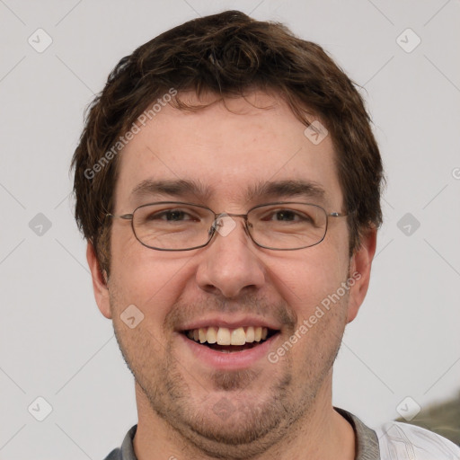 Joyful white adult male with short  brown hair and grey eyes