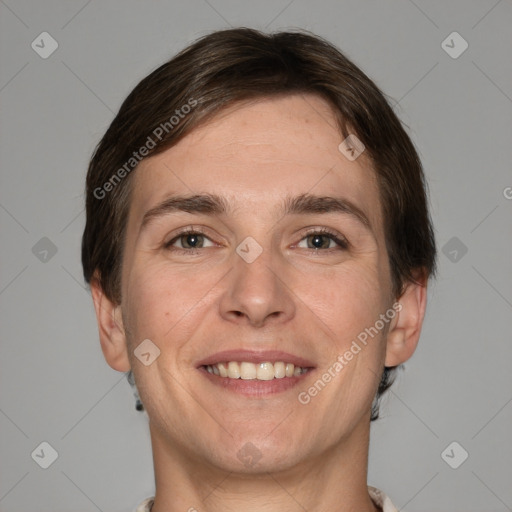 Joyful white adult male with short  brown hair and grey eyes