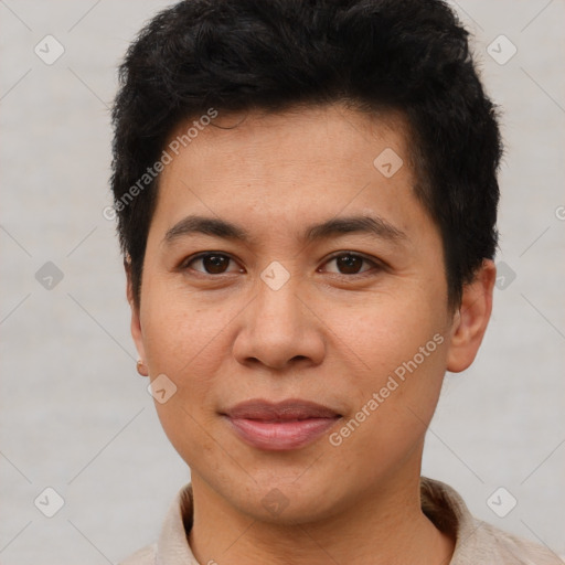 Joyful latino young-adult male with short  brown hair and brown eyes