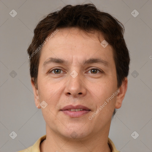 Joyful white adult male with short  brown hair and brown eyes