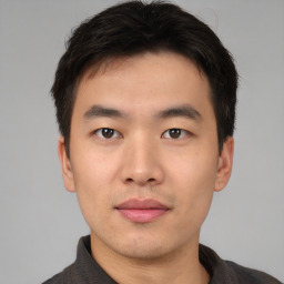 Neutral asian young-adult male with short  brown hair and brown eyes