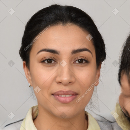 Joyful latino young-adult female with medium  brown hair and brown eyes