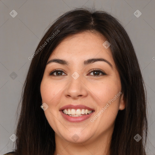 Joyful white young-adult female with long  brown hair and brown eyes