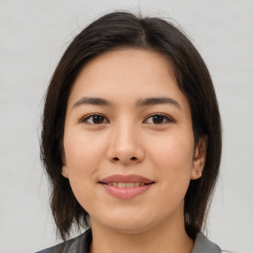 Joyful white young-adult female with medium  brown hair and brown eyes