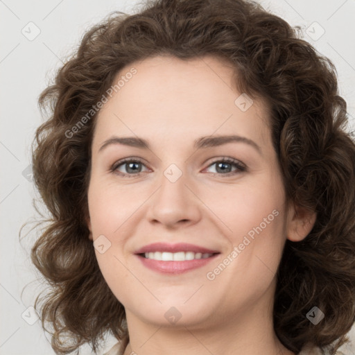 Joyful white young-adult female with medium  brown hair and green eyes