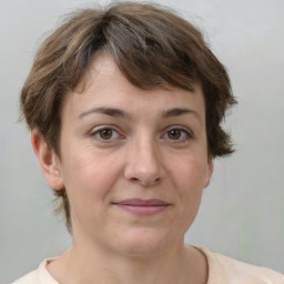 Joyful white adult female with short  brown hair and brown eyes