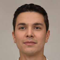 Joyful white young-adult male with short  brown hair and brown eyes