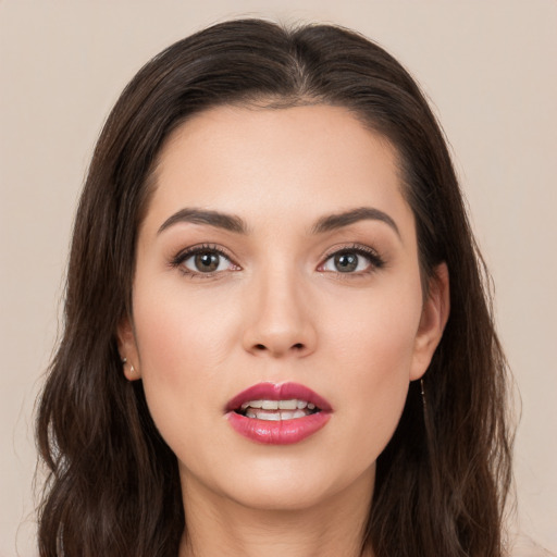 Joyful white young-adult female with long  brown hair and brown eyes