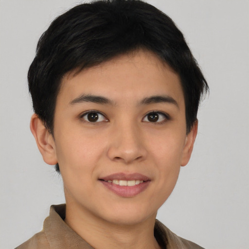 Joyful asian young-adult female with short  brown hair and brown eyes