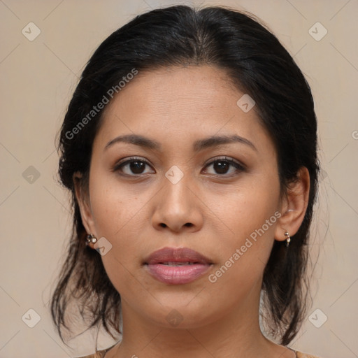 Joyful latino young-adult female with medium  brown hair and brown eyes