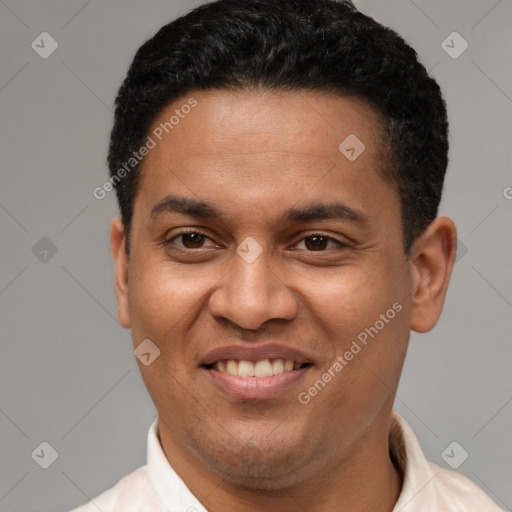 Joyful latino young-adult male with short  brown hair and brown eyes