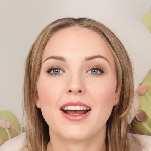 Joyful white young-adult female with medium  brown hair and green eyes