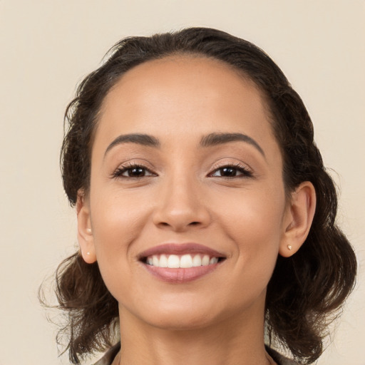 Joyful white young-adult female with medium  brown hair and brown eyes