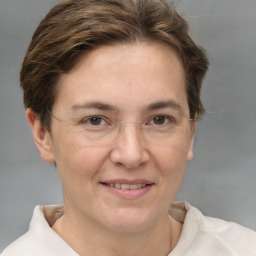 Joyful white adult female with short  brown hair and brown eyes