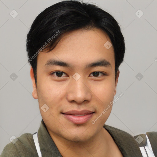 Joyful asian young-adult male with short  black hair and brown eyes