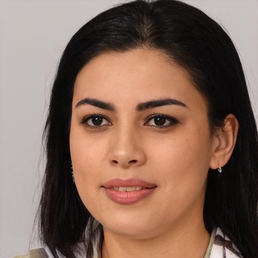 Joyful asian young-adult female with long  black hair and brown eyes