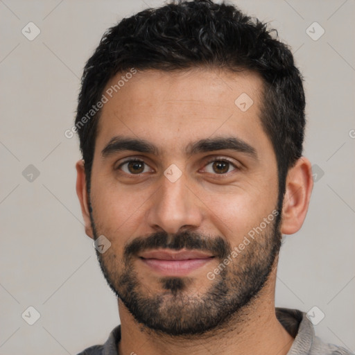 Joyful latino young-adult male with short  black hair and brown eyes