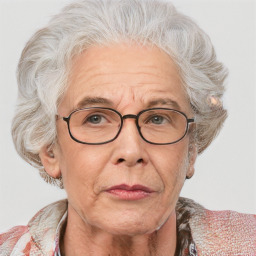 Neutral white middle-aged female with medium  gray hair and blue eyes