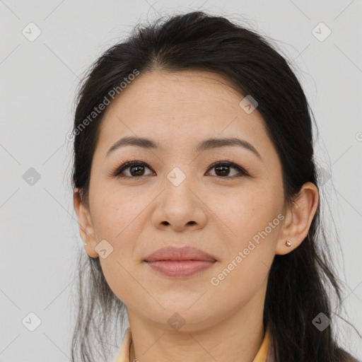 Joyful latino young-adult female with long  brown hair and brown eyes