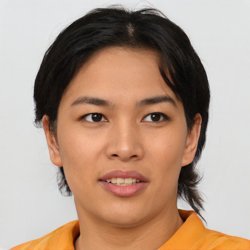 Joyful asian young-adult female with short  black hair and brown eyes