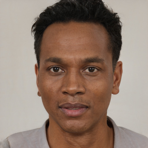 Neutral black young-adult male with short  black hair and brown eyes