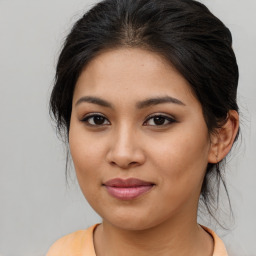 Joyful asian young-adult female with medium  brown hair and brown eyes