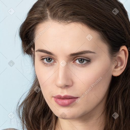 Neutral white young-adult female with long  brown hair and brown eyes