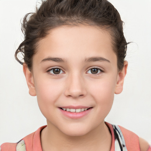 Joyful white child female with short  brown hair and brown eyes