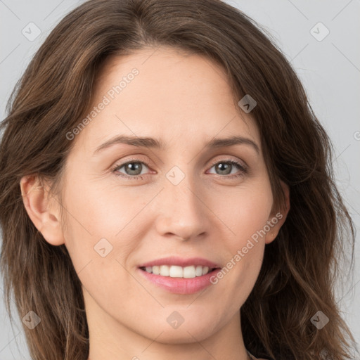 Joyful white young-adult female with long  brown hair and grey eyes