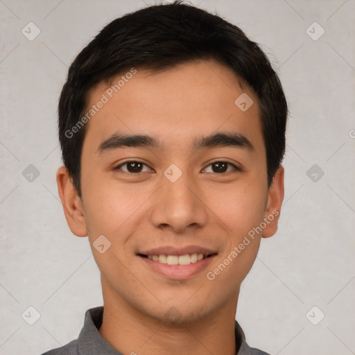 Joyful white young-adult male with short  black hair and brown eyes